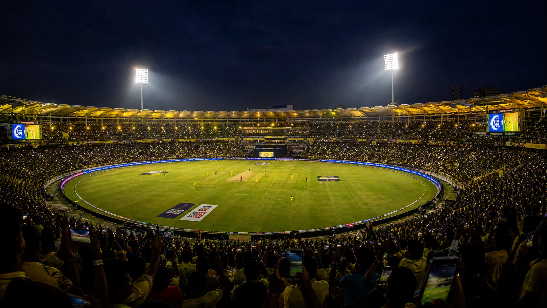 Cricket stadium at night representing FairPlay information and match coverage